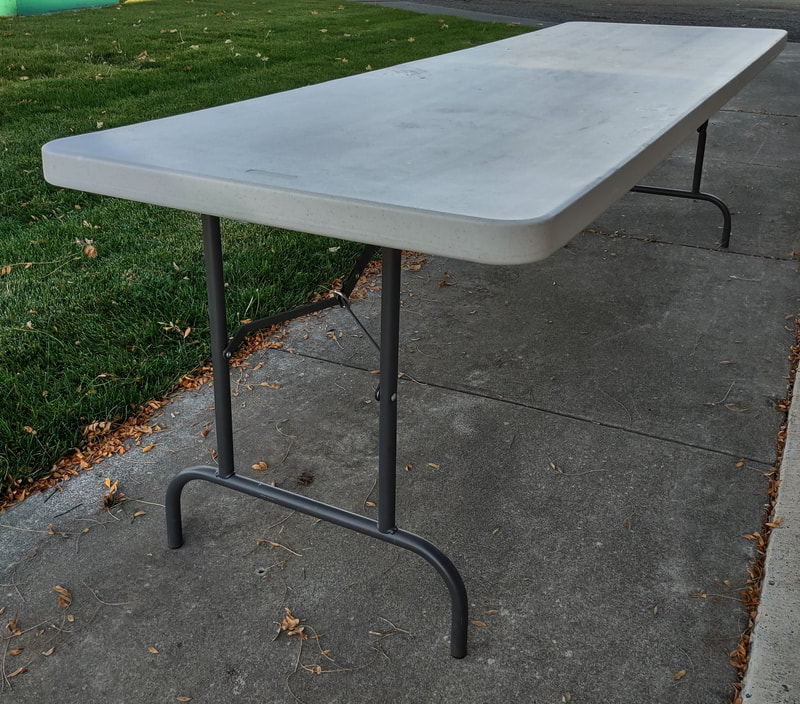 8' Plastic Folding Table. One (1) available. Also available: Two (2) 6' tables. Replacement value: $140