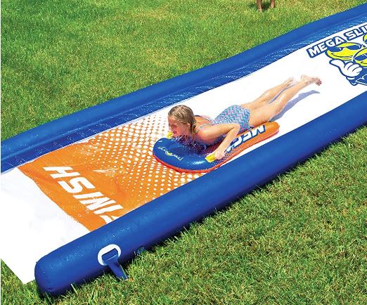 Giant Backyard Waterslide with Sprinkler. Zig-zag spray pattern sprinkler system runs the length of the slide for awesome water coverage for great sliding, connects easily to a water hose. Extra-thick, heavy-duty PVC, more than twice as thick as most lawn slides on the market.
Super-slick embossed PVC so no need to add soap, 8 inch high side-wall pontoon to keep the sliders and the water on the slide.
Comes with two 36"x24" Mega sleds to soften the impact on the ground when sliding and for a more slippery ride.  25' long. Replacement Value: $150 